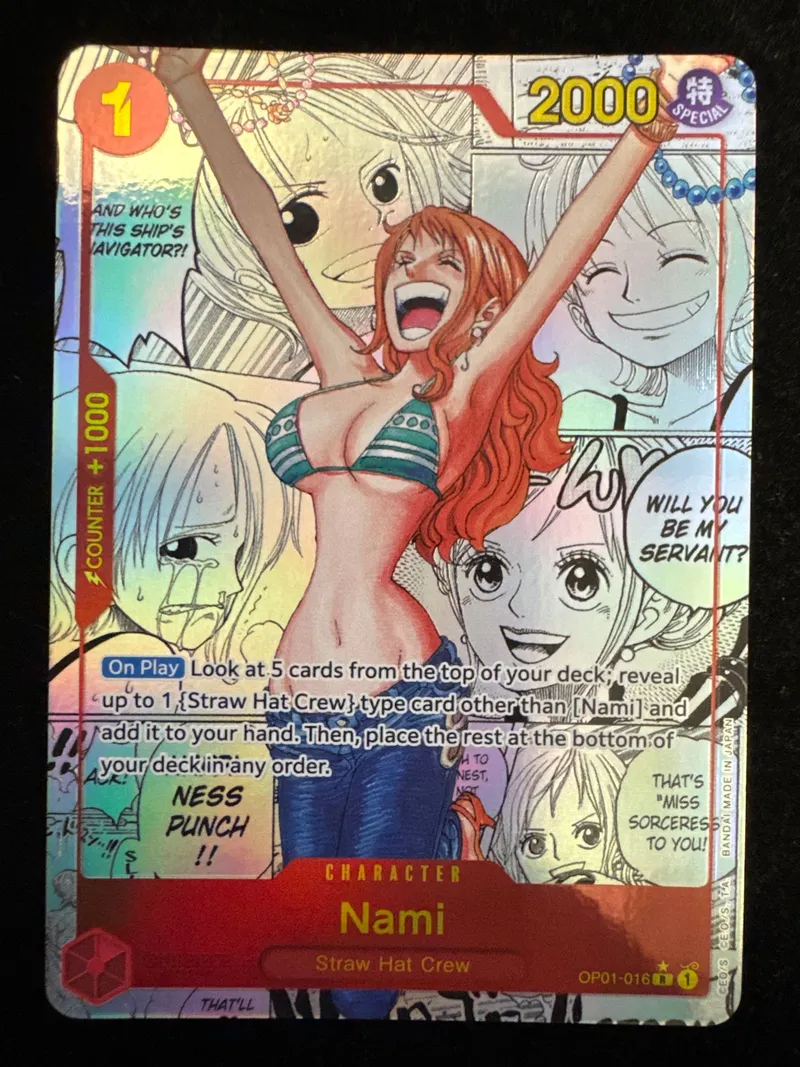 The same Nami OP01-016 manga rarity foil front after restoration at CardRevive, clean, photographed under soft angled light